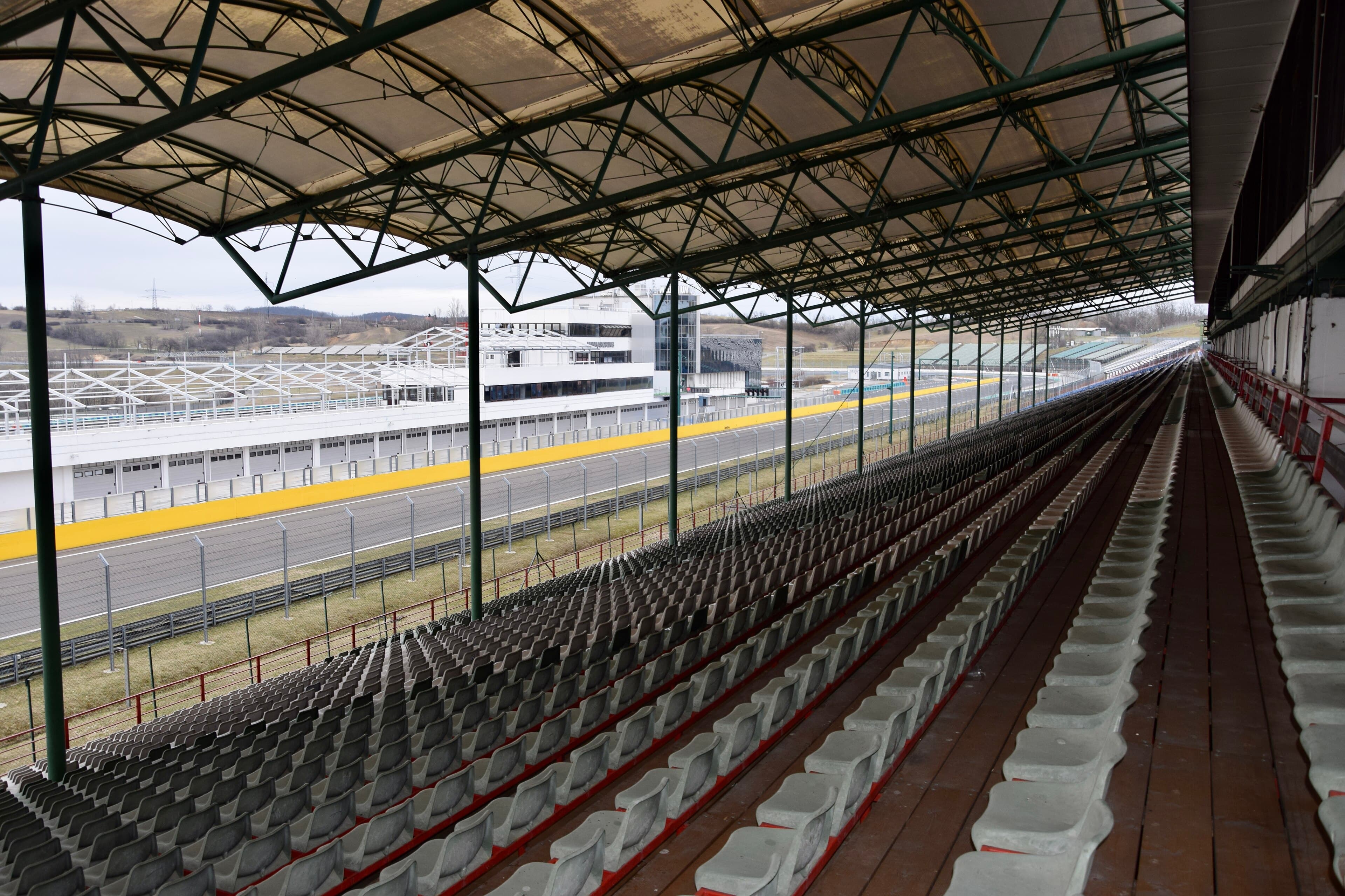 Archival 2015 view from the covered Hungaroring main grandstand across the track and pit building