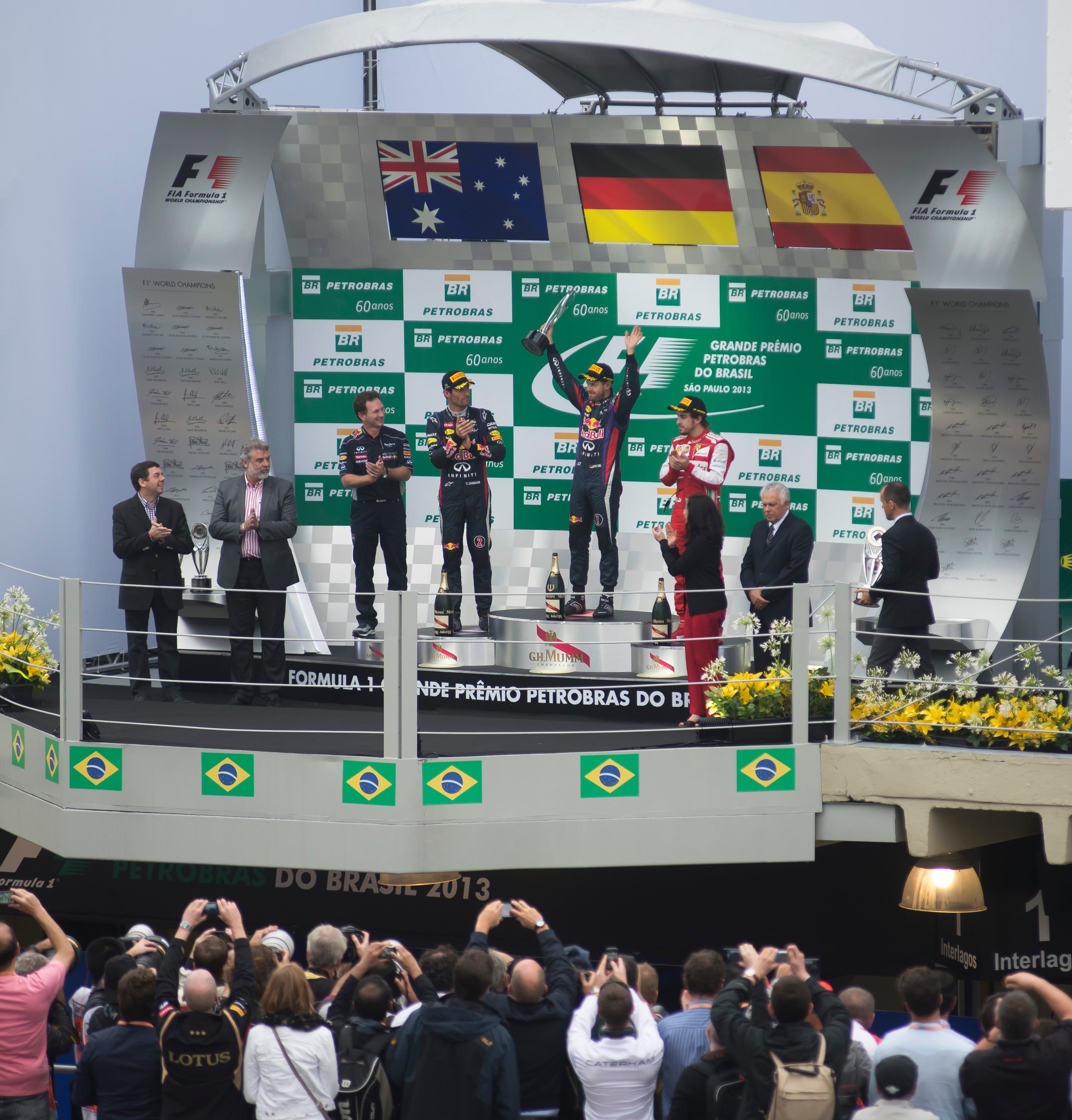 Podium and main straight seen through a crowd at the 2013 Brazilian Grand Prix at Interlagos