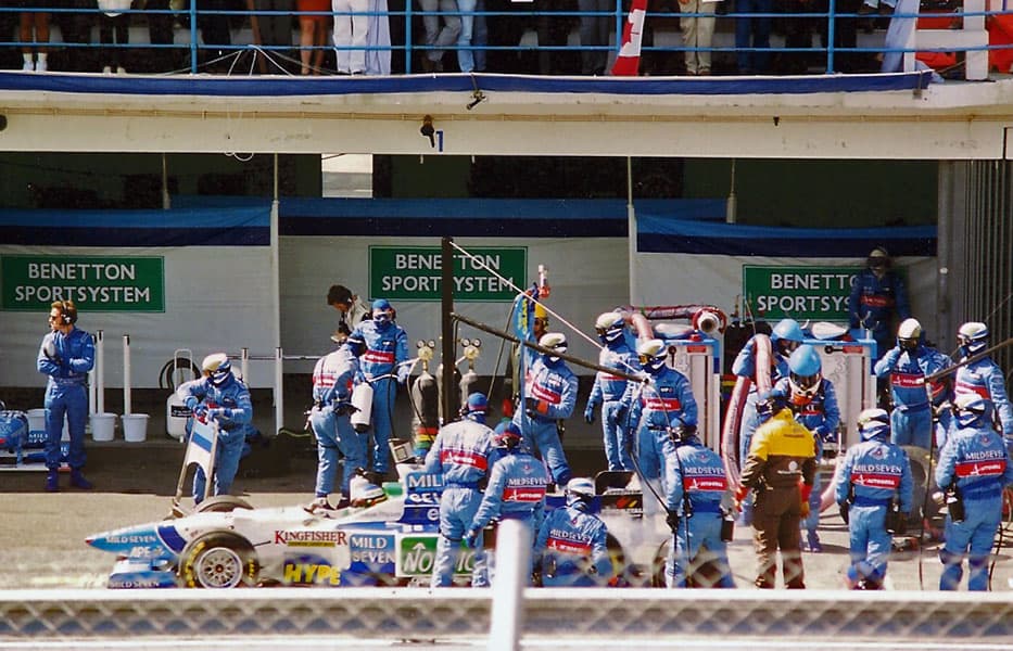 The Benetton Formula 1 team servicing Jean Alesi's car during the 1996 Portuguese Grand Prix
